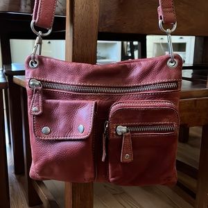 Red Fossil cross body bag.